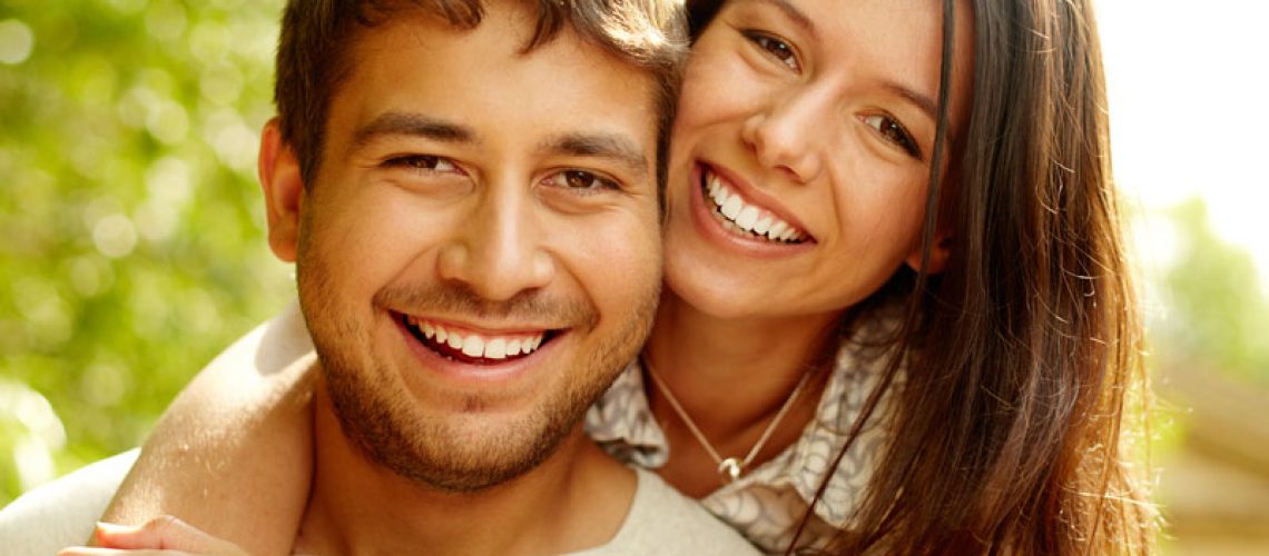 Dental Patients Smiling With Well Cared For Dental Implants In Miami, FL